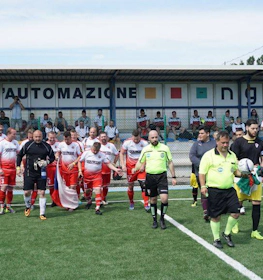 Teams walking onto the field before a match at Adriatica Cup I football tournament