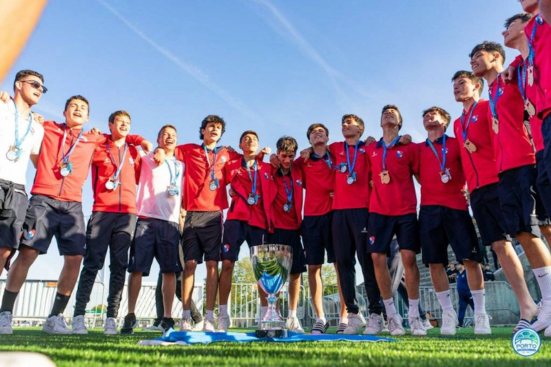 Youth football team with medals at Porto International Cup tournament