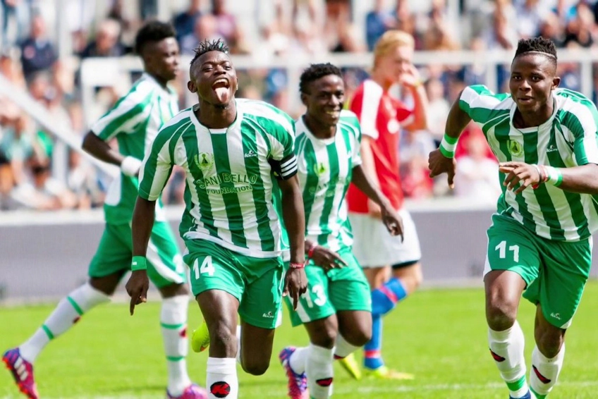 Футболисты в зелено-белой форме радуются голу на турнире Dana Cup Hjørring