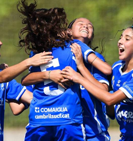 Girl footballers celebrating a goal at the Costa Daurada Verano Cup tournament