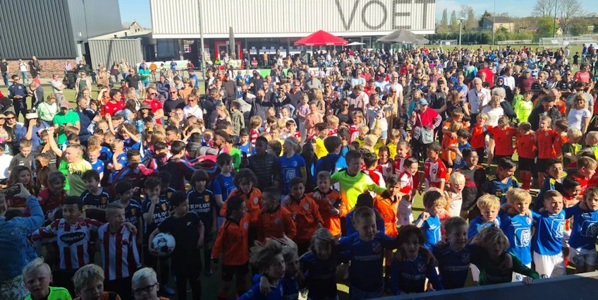 Crowd of children in football kits at Limburgse Peel Cup tournament
