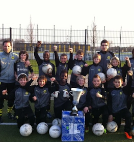 Youth football team with trophy at Young Talents Cup tournament