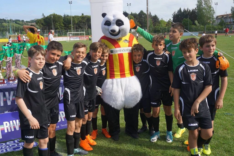 Young footballers with mascot at the Riviera Trophy SC tournament