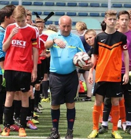 Referee and young footballers before a match at Riccione Football Cup tournament